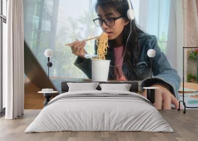 Young Asian woman working from home with her cat Wall mural