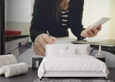 business using smartphone on office table with laptop computer and graph financial with social network diagram Wall mural