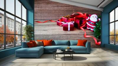 Christmas background with decorations and gift boxes on wooden b Wall mural