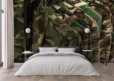 Jacket military style hanging on clothes rack. Wall mural