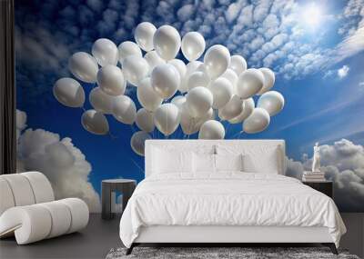 A serene white cloud of helium balloons floating against a cloudy sky Wall mural