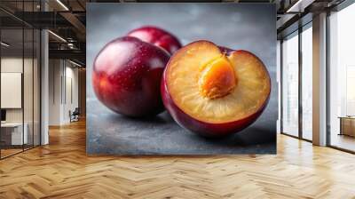 Juicy ripe plum half isolated on gray background Wall mural