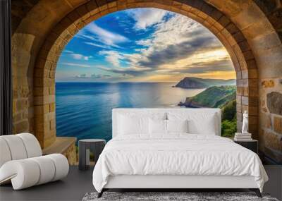 Stone archway overlooking tranquil coastal landscape from above, bird's eye view Wall mural