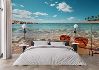 shore beach background with clear sea water and sun glasses on the sand  Wall mural