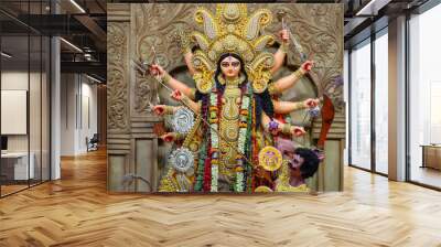 Idol of Goddess Devi Durga at a decorated puja pandal in Kolkata, West Bengal, India. Durga Puja is a popular and major religious festival of Hinduism that is celebrated throughout the world. Wall mural