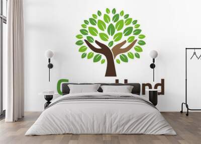 Human hands and tree with green leaves. Logo, symbol, icon, illustration, vector, template, design Wall mural