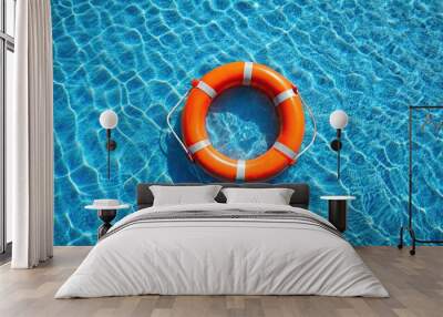 Aerial view of bright orange lifebuoy in serene pool, serene, pool, clear, rippling, waters, bright orange Wall mural