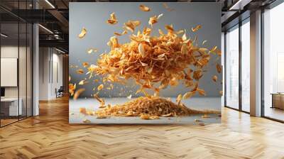 Golden toasted coconut flakes floating mid-air on a neutral backdrop, coconut, toasted, golden, flakes, floating Wall mural