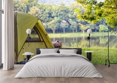 camping green tent in forest near lake Wall mural