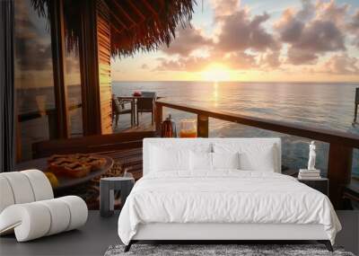 A luxurious overwater bungalow with a private deck serving sunrise breakfast and mimosas Wall mural