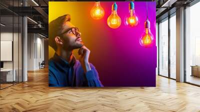 A young entrepreneur brainstorming innovative ideas for a startup, symbolizing innovation, creativity, and growth, photorealistic, vibrant lighting, 8k Wall mural