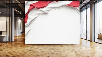 Overhead view of the American flag with flowing red, white, and blue fabric on a white background, perfect for patriotic themes or national events. Wall mural