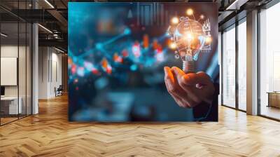 Businessman holding creative light bulb with growth graph, analytics icons. Utilizing analytics technology to develop new strategies and insights that enhance successful performance in global business Wall mural