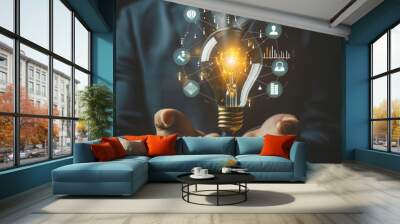 Businessman holding creative light bulb with growth graph, analytics icons. Utilizing analytics technology to develop new strategies and insights that enhance successful performance in global business Wall mural