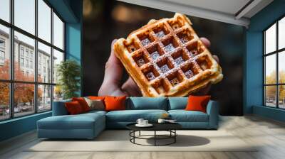 Waffle held in hand Wall mural