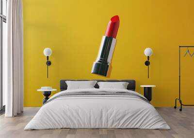 A lipstick is flying in the air against a yellow background. Wall mural