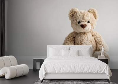 Adorable teddy bear standing alone on a white background Wall mural