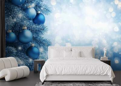 Christmas tree with blue ornaments. The lights are out of focus, creating a dreamy effect. Wall mural