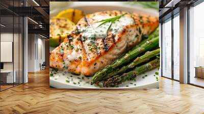 Grilled salmon and asparagus with a creamy white sauce made with butter, flour, and milk Wall mural