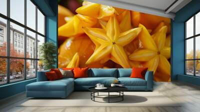 Star fruits, a tropical fruit with five sharp sides, are native to Southeast Asia. They have a sweet and tart flavor and are often used in salads, juices, and desserts. Wall mural