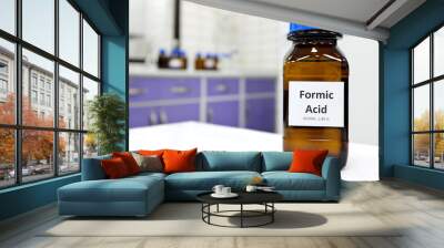 Selective focus of Formic acid solution in brown amber bottle. Blur white laboratory backdrop with copy space. Wall mural