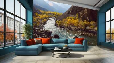 Beautiful nature landscape view of winding river flowing along valley in Hindu Kush mountain range. Autumn season in Gupis Ghizer, Gilgit Baltistan, Pakistan. Wall mural