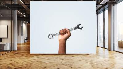 Holding tools in hand. Happy labor day concept.
 Wall mural