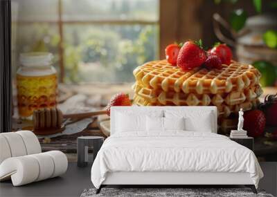 A stack of waffles on a wooden table nearby sits a jar Wall mural