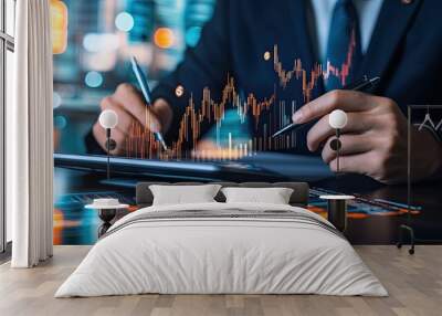 A businessman analyzes financial charts on a tablet, surrounded by data visuals, emphasizing modern analytics and market trends in a digital workspace. Wall mural