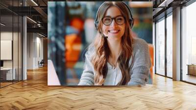 Friendly female customer support agent with headset, sitting at table in a contemporary office, professional and inviting Wall mural