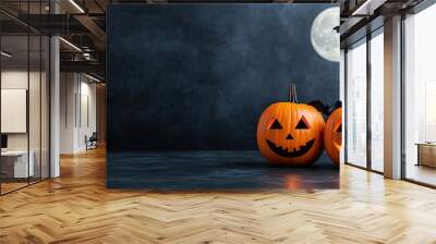 Spooky Halloween scene featuring two carved pumpkins under a full moon with a flying bat for a festive atmosphere. Wall mural