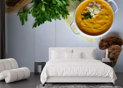 Corn soup with parsley and bread on a white background Wall mural