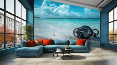 A pair of scuba diving goggles lay on the sandy beach, with azure waters and blue skies creating a picturesque natural landscape. Vision care eyewear for underwater adventures AIG50 Wall mural