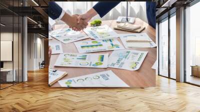 Business people hand shake in Eco corporate meeting room after made successful agreement deal on eco-friendly products. Sustainability and environmental protection in business cooperation.Trailblazing Wall mural