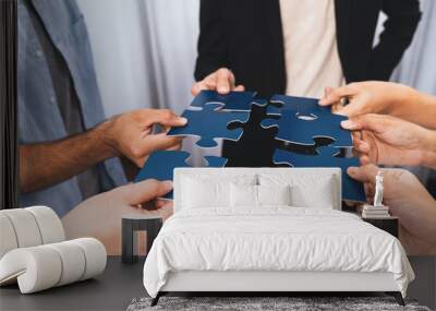 Business team joining jigsaw puzzle together symbolize group of business partnership and strong collective unity teamwork in problem solving solution for business success. Prudent Wall mural