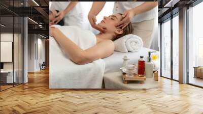 Caucasian couple enjoying relaxing anti-stress head massage and pampering facial beauty skin recreation leisure in dayspa modern light ambient at luxury resort or hotel spa salon. Quiescent Wall mural