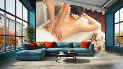 Caucasian woman customer enjoying relaxing anti-stress spa massage and pampering with beauty skin recreation leisure in day light ambient salon spa at luxury resort or hotel. Quiescent Wall mural