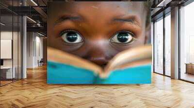 Close up of curious smart children 's eye hiding behind the comic book with blurring background. Elementary student looking at camera surrounded with diverse children. Education concept. AIG42. Wall mural