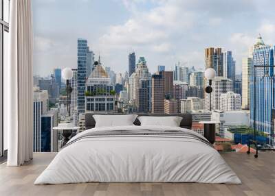 Closeup image of Bangkok cityscape. Modern cityscape surrounded with architectural building with day light and blue sky. Side view. Business background. Day light. Ornamented. Wall mural