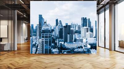 Closeup image of Bangkok cityscape. Modern skyscrapers with monochrome blue filter. Modern architectural building skyline with blue sky. Side view. Business background. Day light. Ornamented. Wall mural