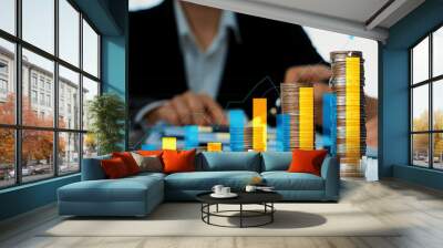 Coin stack with digital graphic indicator symbolizing business investment and economic growth. Businessman doing financial planning to achieve financial goal and contribute to profit. Shrewd Wall mural