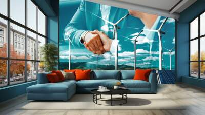 Double exposure graphic of business people handshake over wind turbine farm and green renewable energy worker interface. Concept of sustainability development by alternative energy. uds Wall mural