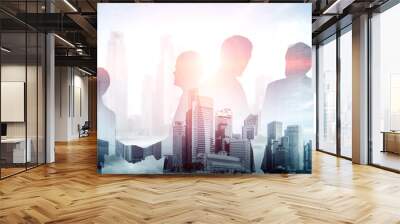 Double exposure image of many business people conference group meeting on city office building in background showing partnership success of business deal. Concept of teamwork, trust and agreement. Wall mural