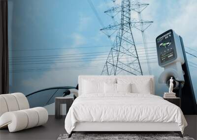 EV electric car at recharging at charging station connected to electrical power grid tower on sky background as electrical industry for eco friendly rechargeable vehicle utilization. Expedient Wall mural