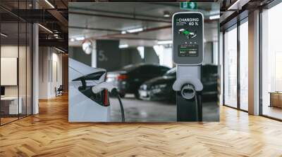 EV electric car recharge at shopping center parking lot charging in downtown city showing urban sustainability lifestyle by green clean rechargeable energy of electric vehicle innards Wall mural