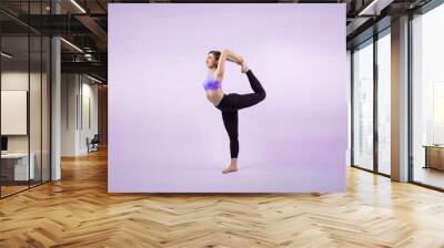 Full body length gaiety shot athletic and sporty woman doing healthy and meditative yoga exercise workout posture on isolated background. Healthy active and body care lifestyle Wall mural