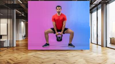 Full body length gaiety shot athletic and sporty young man with fitness in squat exercise posture on isolated background. Healthy active and body care lifestyle. Wall mural