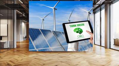 Green business transformation for environment saving and ESG business concept. Businessman using tablet to set corporate goal toward environmental friendly management and alternative clean energy use. Wall mural