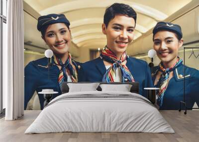 Group of cabin crew or air hostess in airplane . Airline transportation and tourism concept. Wall mural