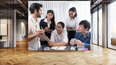 Group of diverse office worker employee working together on strategic business marketing planning in corporate office room. Positive teamwork in business workplace concept. Prudent Wall mural